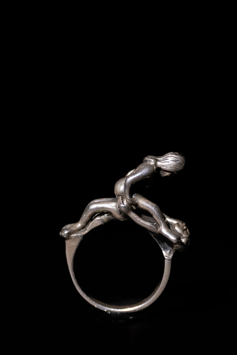 Lot 287: A Silver Erotic Figural Ring.