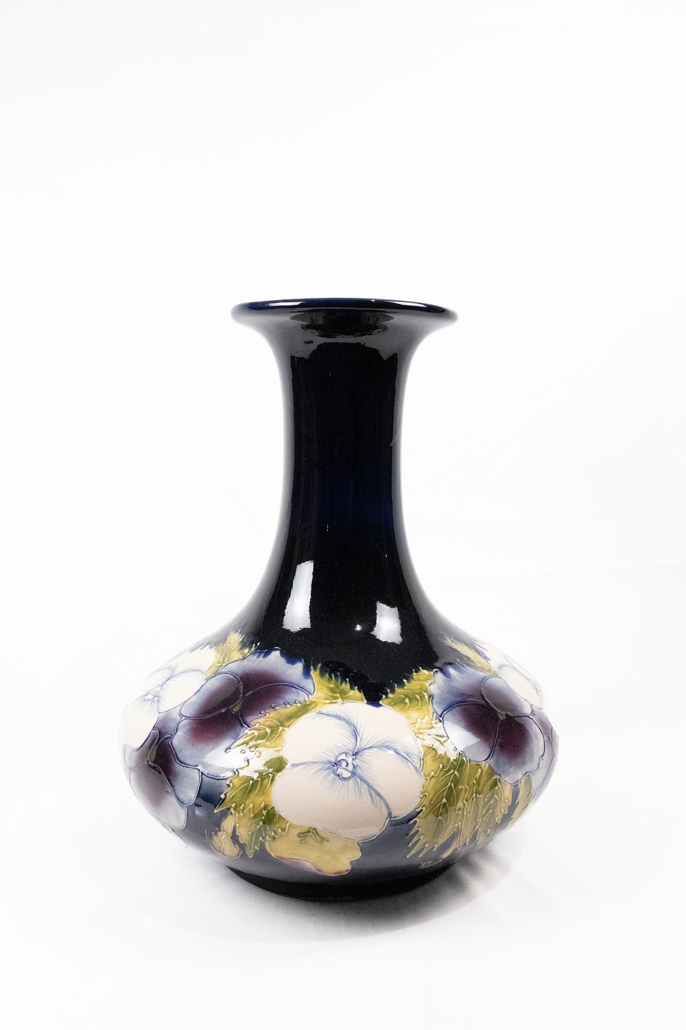 Lot 288: A Signed 1913 Moorcroft Pansy Pattern Vase.
