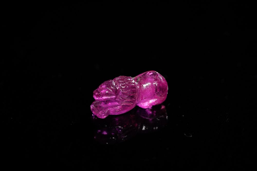 Lot 159: An Indian Carved Pink Gemstone Lion Figure, Possibly...