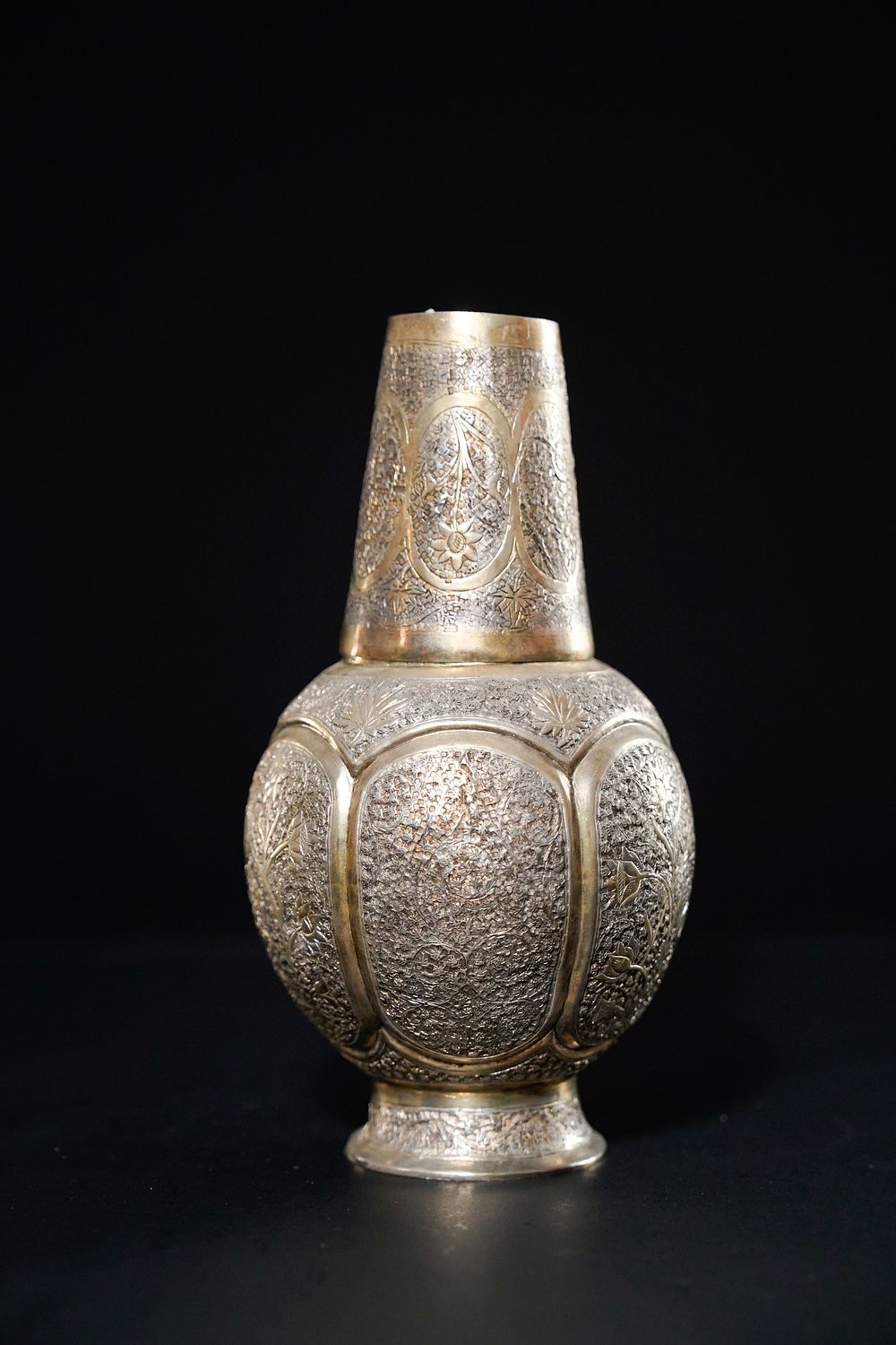 Lot 162: A Kashmiri Silver Bottle and Beaker Set.