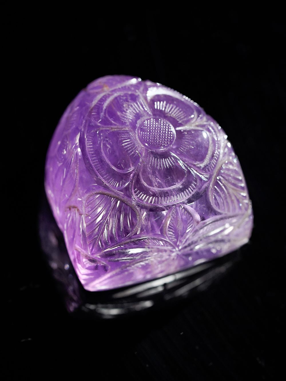 Lot 184: A Mughal Style Carved Amethyst Paperweight.