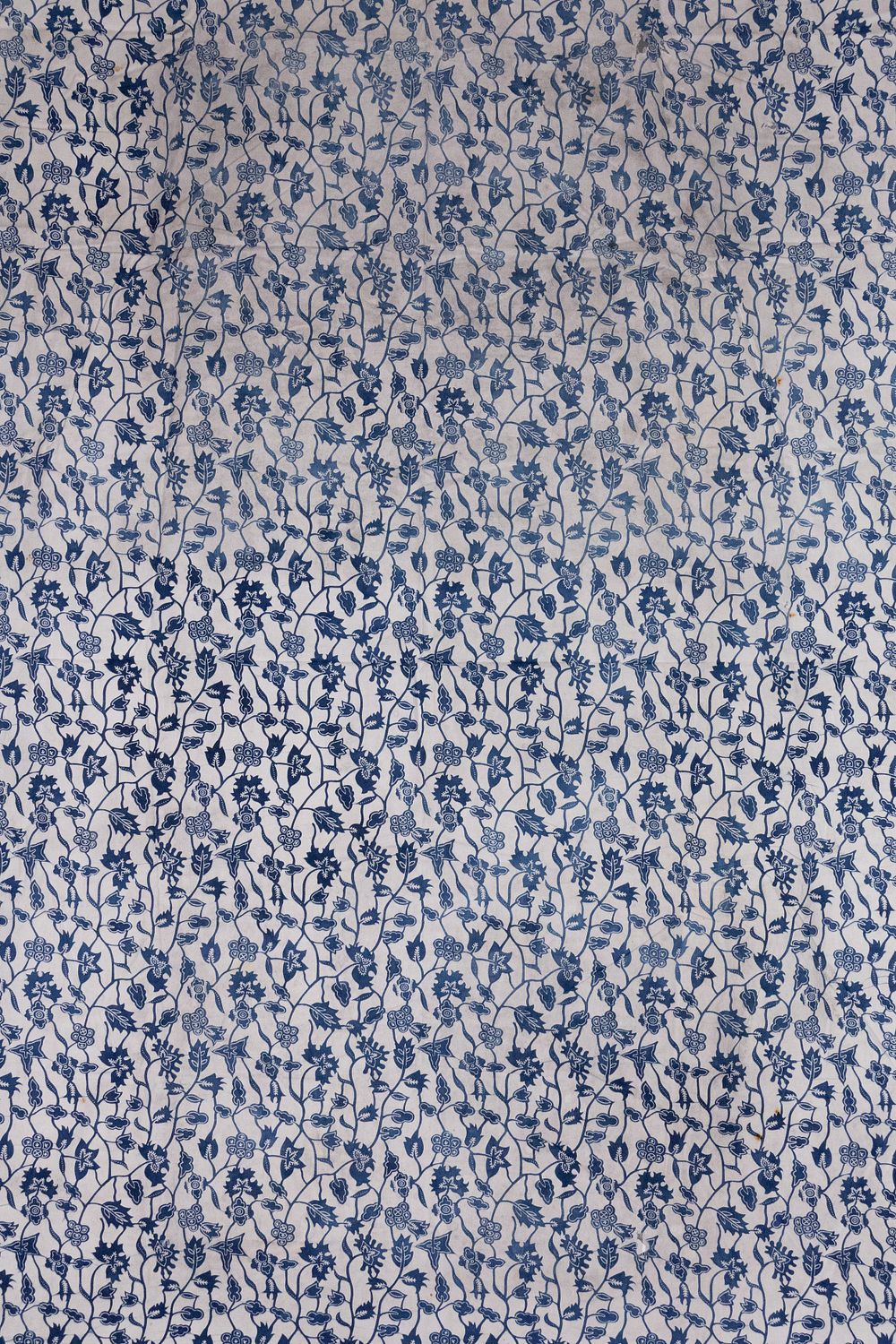 Lot 252: An Indonesian Cotton Batik Textile with Indigo Floral...