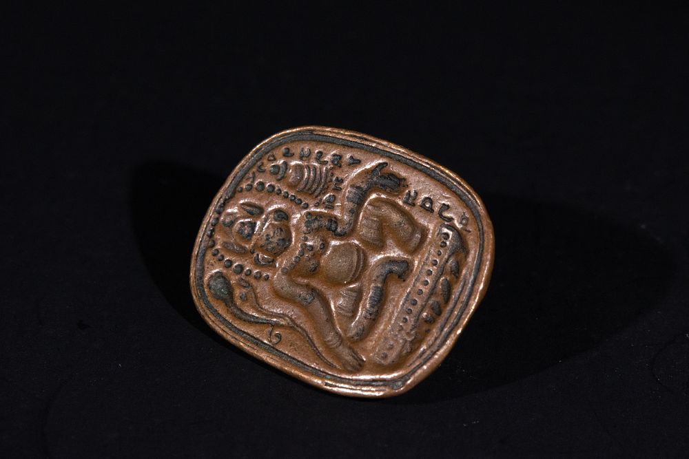 Lot 257: A Tibetan Bronze Stamp Seal with Avalokiteshvara Motif.