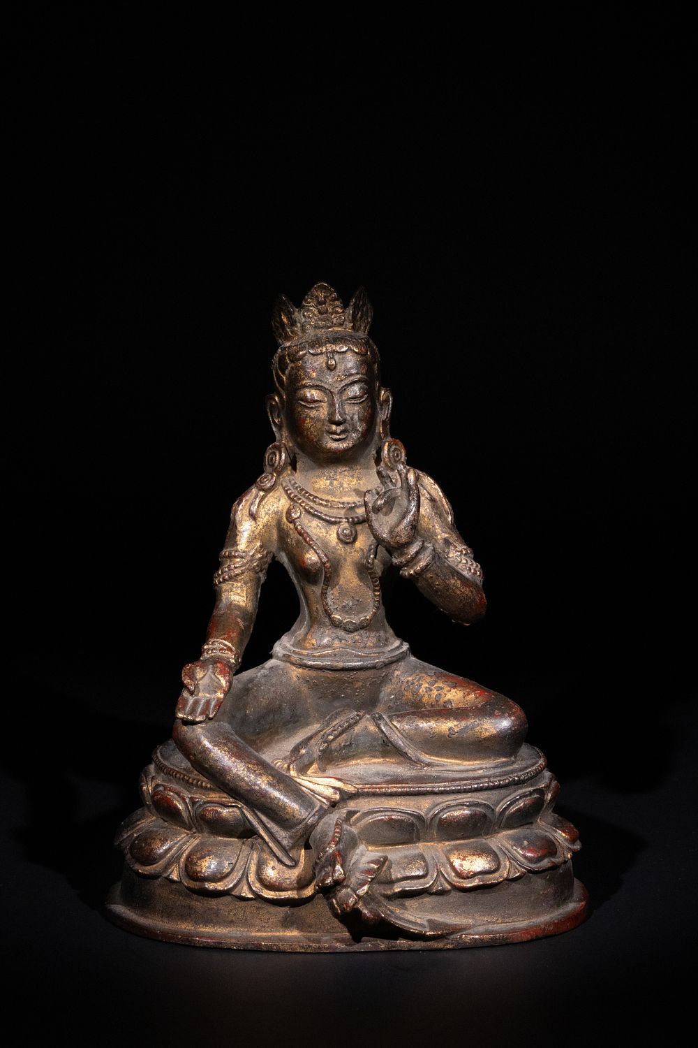 Lot 259: A Tibetan Gilt Bronze Seated Figure of Green...