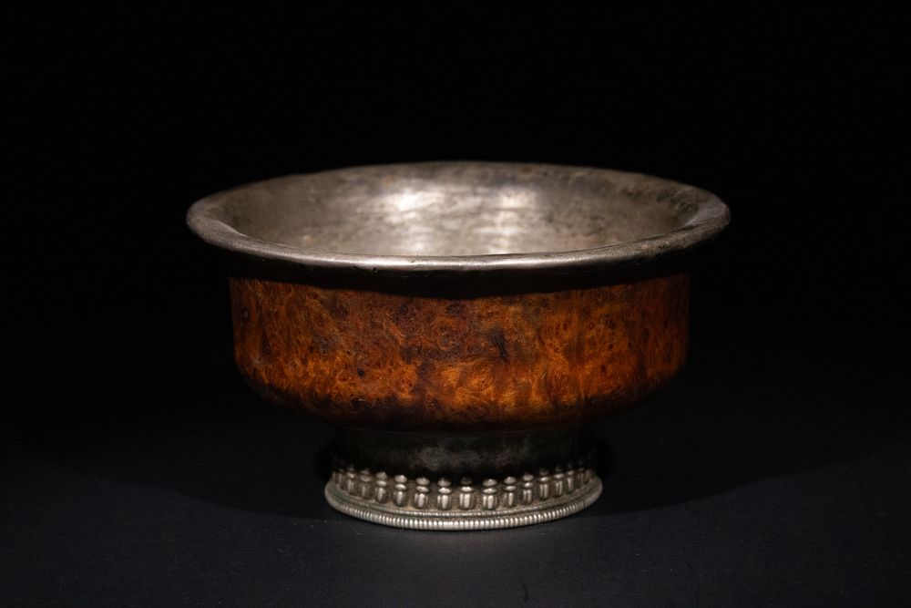 Lot 265: A Tibetan Wood and White Metal Singing Bowl