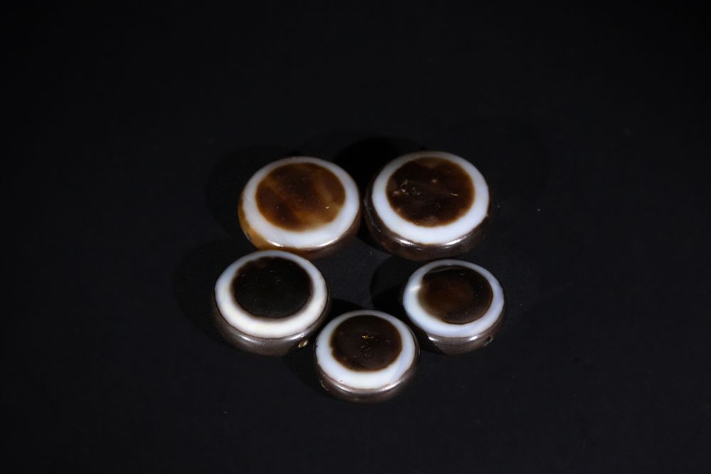 Lot 269: A Lot of Five Tibetan Agate Dzi Beads.
