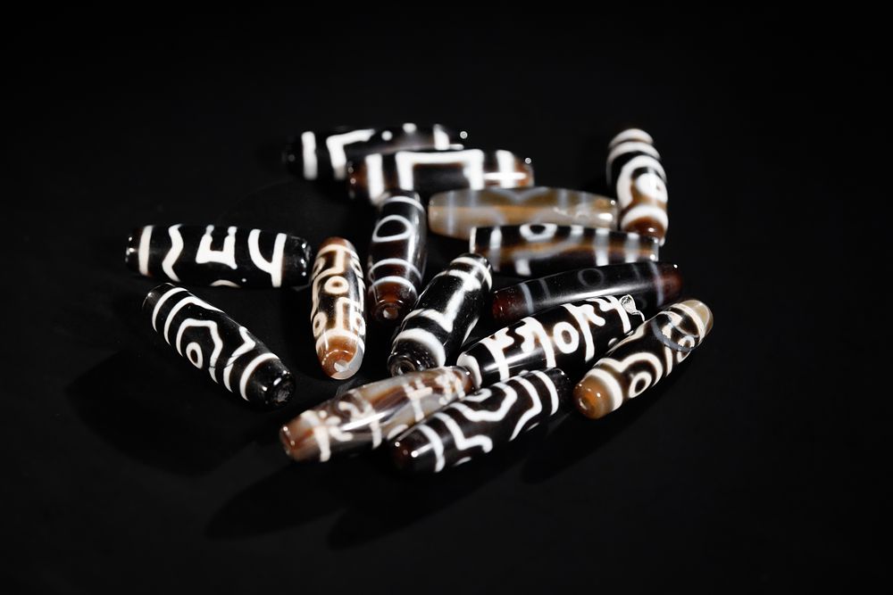 Lot 270: A Collection of Tibetan Dzi Beads with Etched...