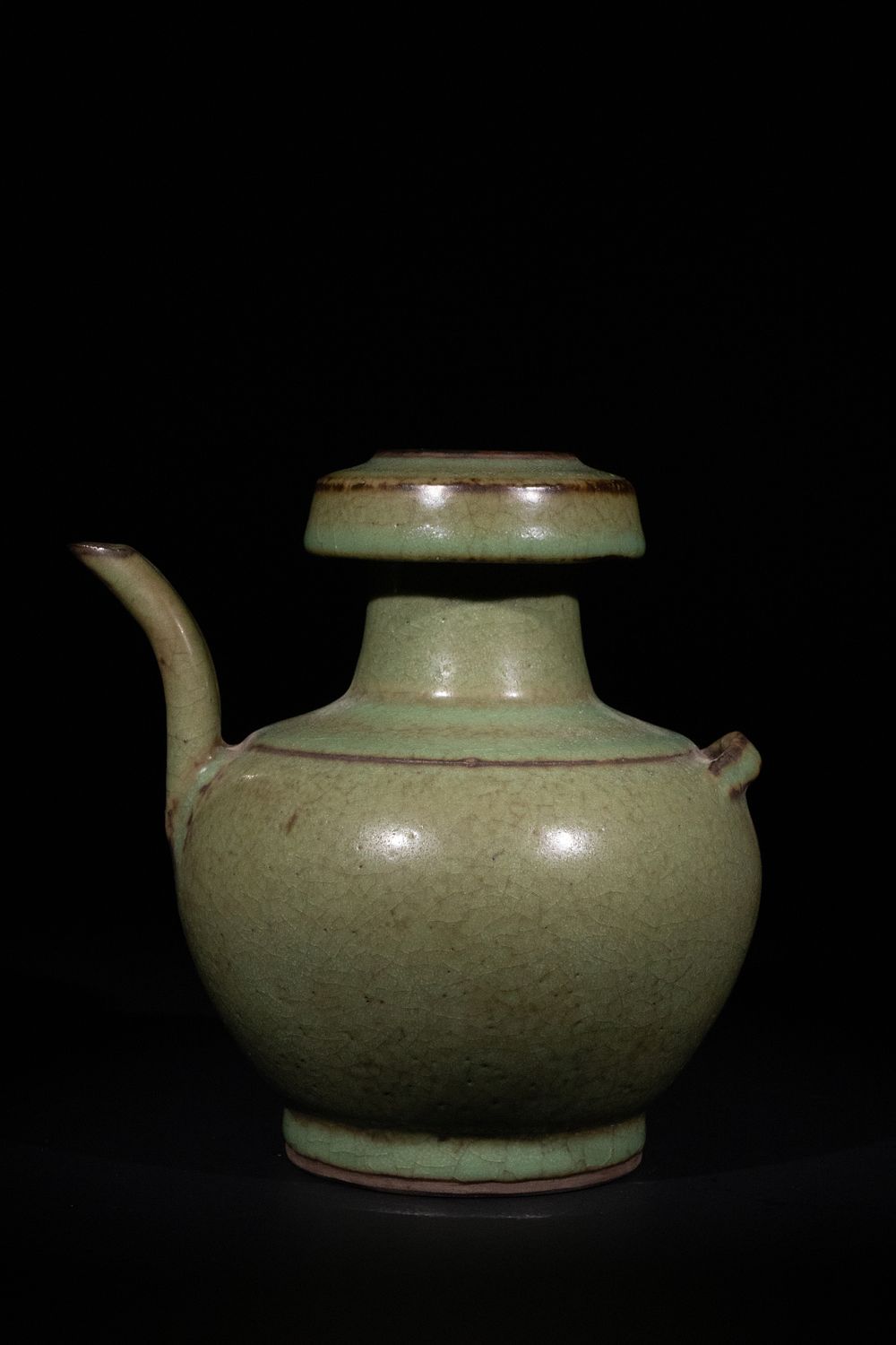 Lot 297: A Chinese Celadon-Glazed Crackled Ewer with Twin Spouts.