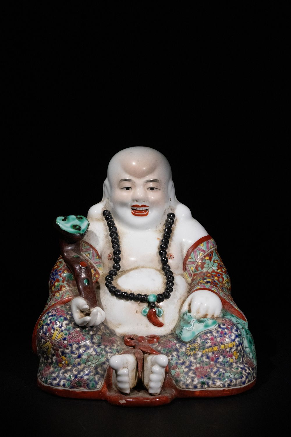Lot 308: A Chinese Famille Rose Porcelain Laughing Buddha Figure.