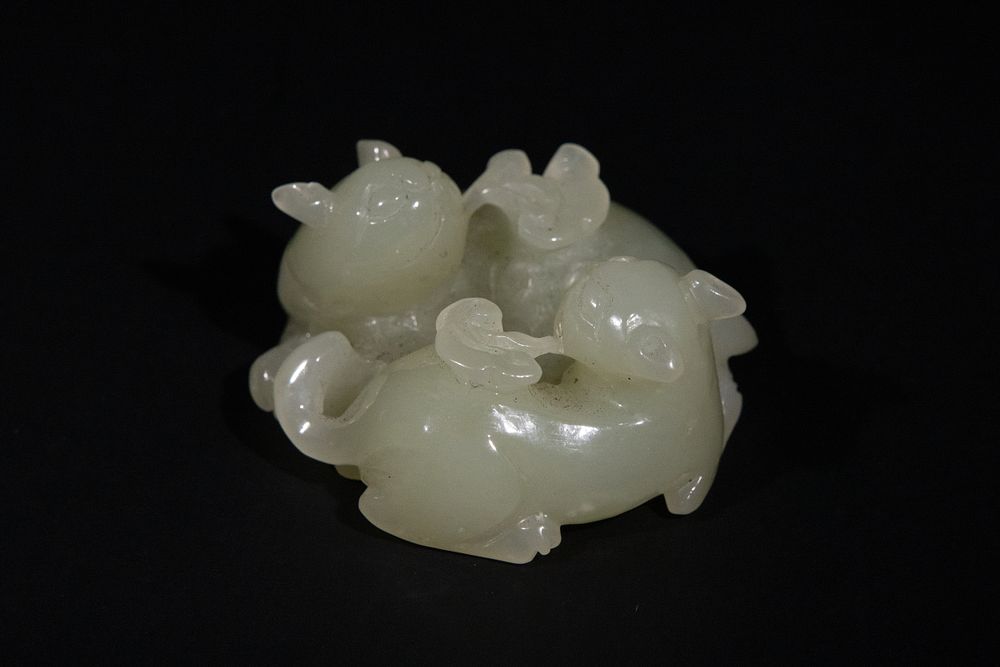 Lot 317: A Chinese White Jade Group of Two Playful...