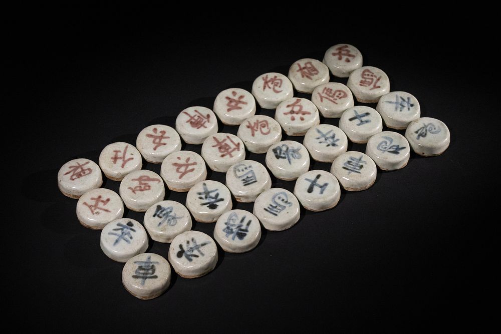 Lot 340: A Chinese Ceramic Chess Set with Hand-Painted Characters.