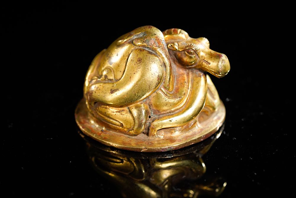 Lot 351: A Chinese Gold Gilt-Bronze Camel Paperweight, 19th Century.