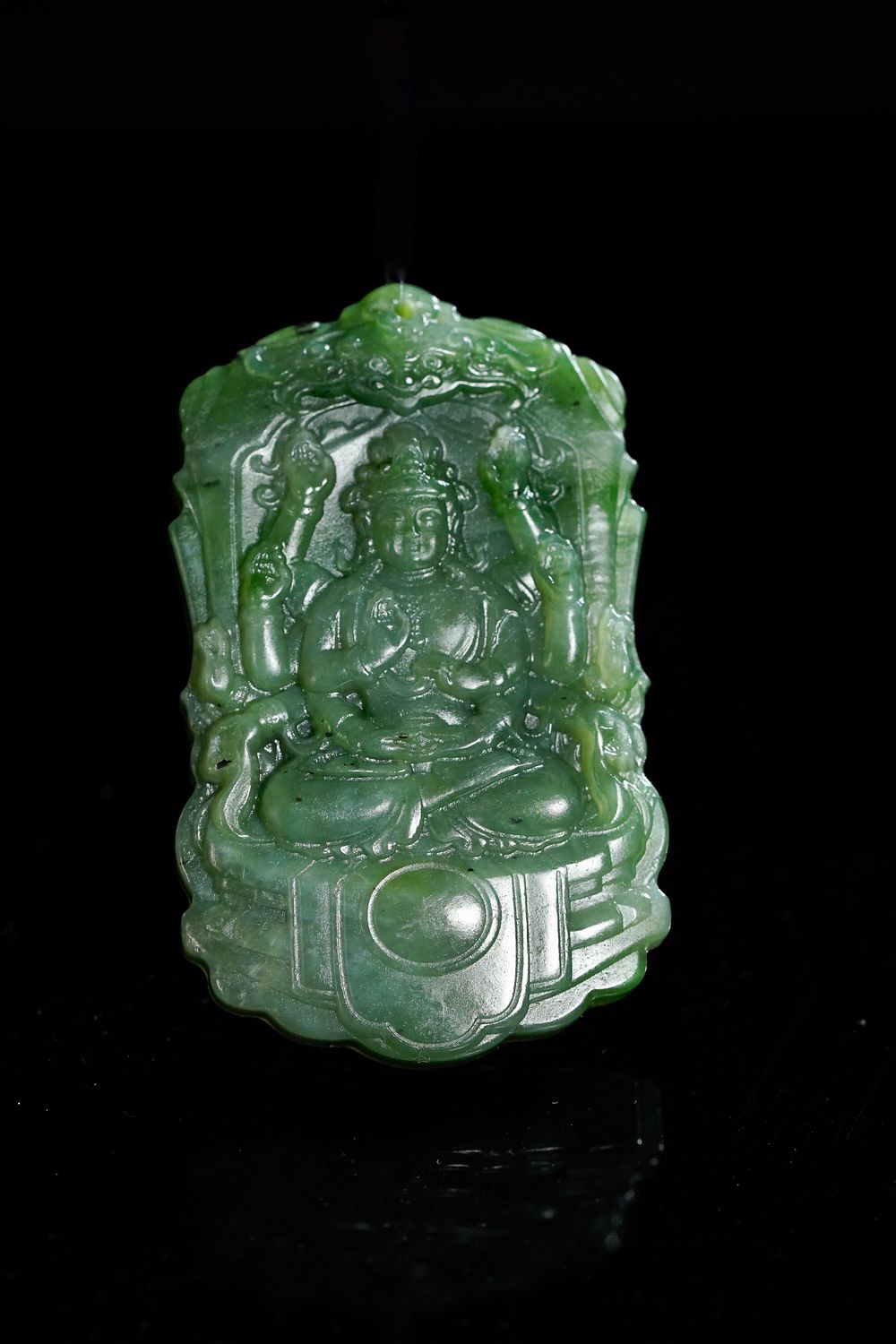 Lot 363: A Chinese Spinach Jade Pendant Depicting a Seated...