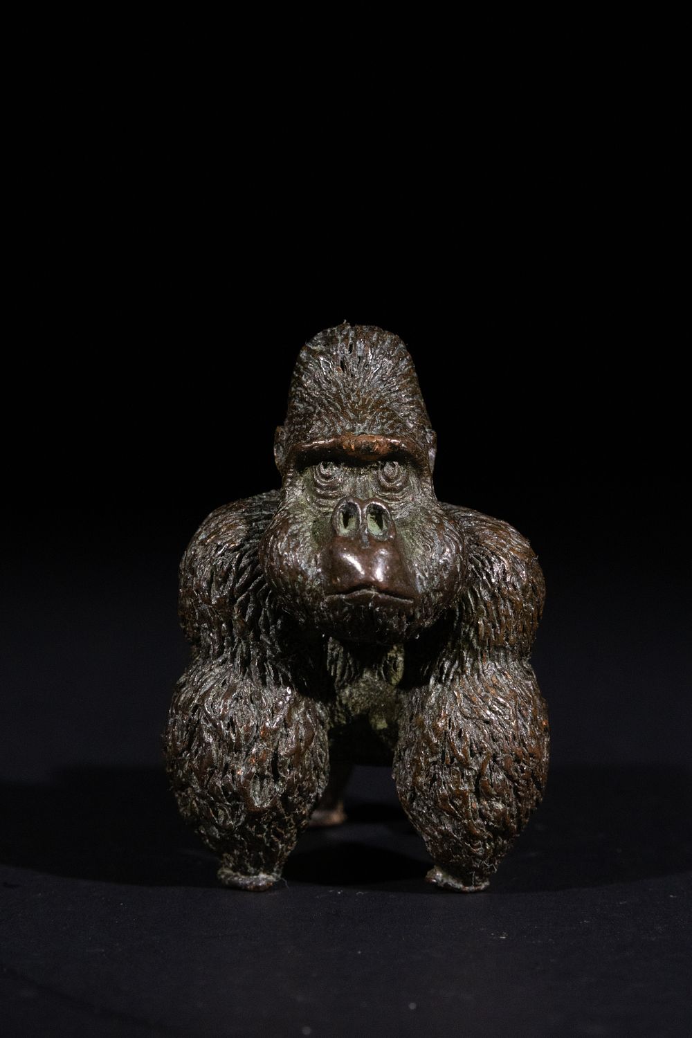 Lot 373: A Japanese Bronze Gorilla Okimono, with Six Character...