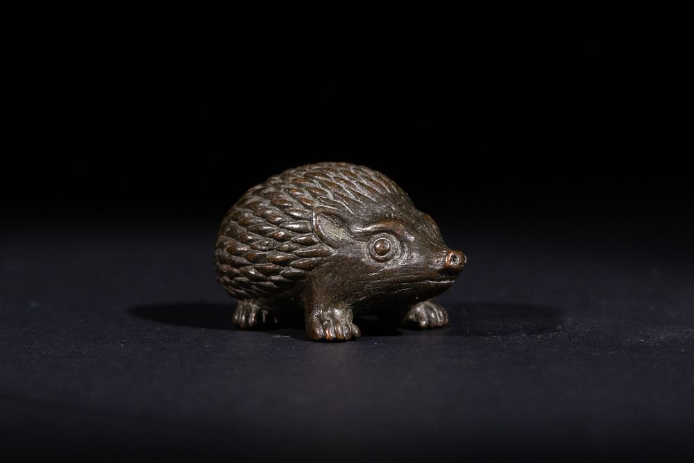 Lot 374: A Japanese Bronze Hedgehog Okimono, with Six Character...