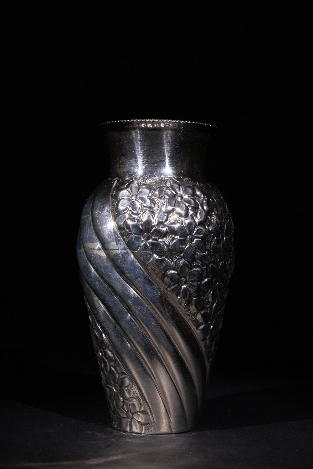 Lot 385: A European 800 Silver Floral-Embossed Vase.