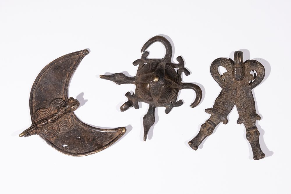 Lot 399: A Collection of Antique West African Bronze Amulets.