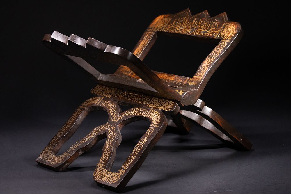 Lot 161: An Indian Wooden Quran Stand with Gilt Calligraphy,...