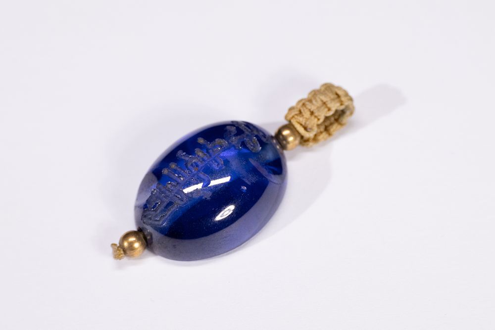 Lot 164: An Indian Blue Gemstone Pendant with Arabic Inscription,...