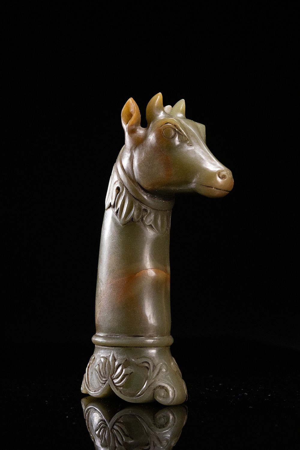 Lot 196: A Mughal Style Jade Dagger Handle Carved with...