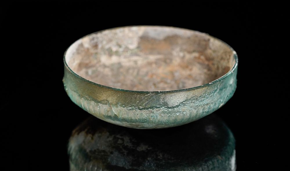 Lot 229: A Roman Green Glass Ribbed Bowl, Circa 1st...