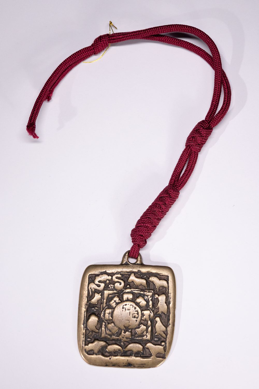 Lot 243: A Tibetan Nine Palace Amulet Plaque, Ming Dynasty.