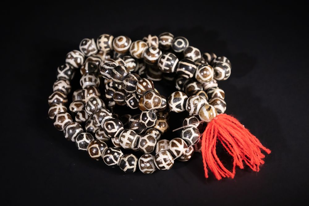 Lot 251: A Tibetan Strand of Etched Dzi Beads with...