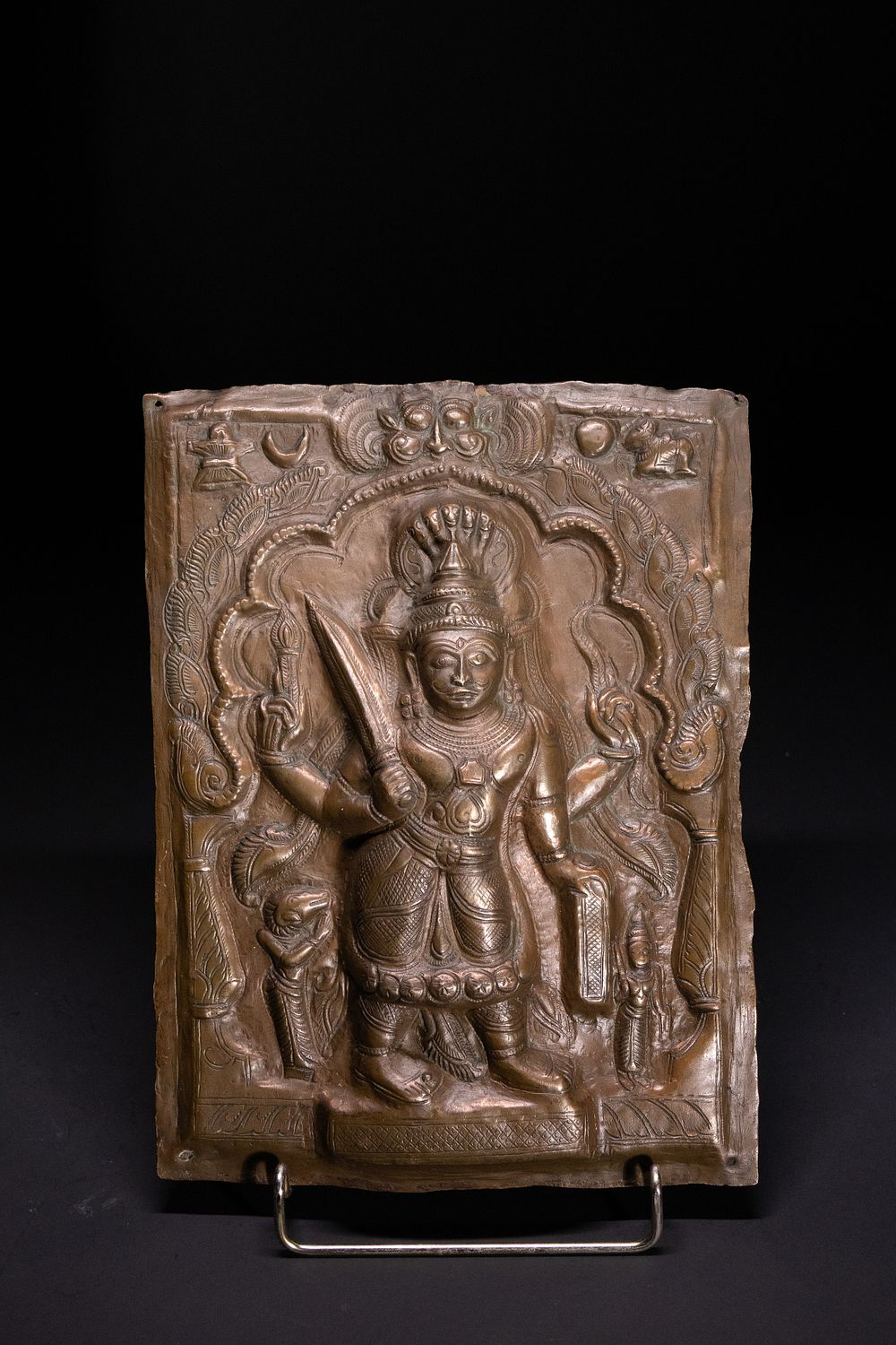 Lot 252: A Tibetan Bronze Plaque Depicting a Guardian Deity,...