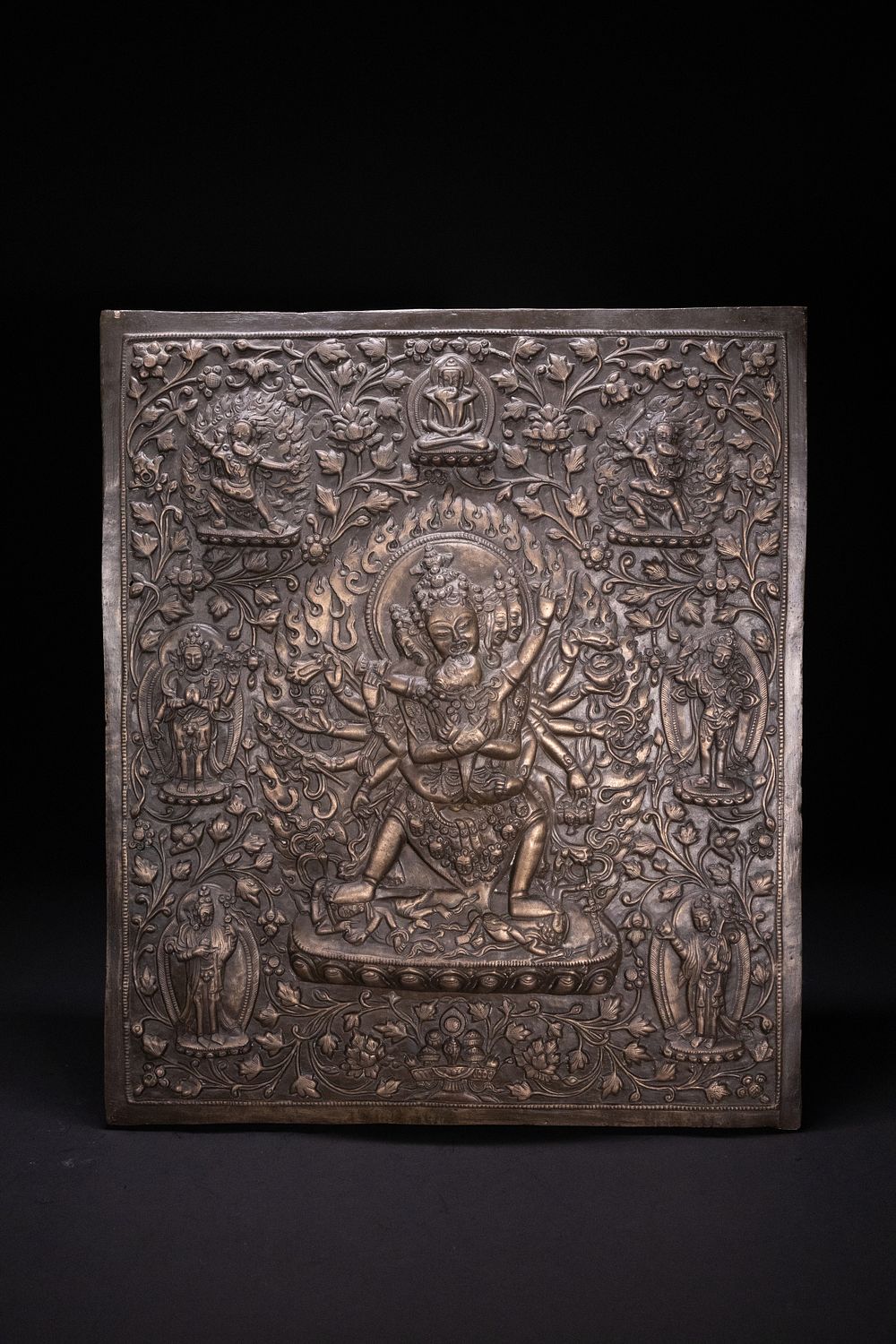 Lot 253: A Tibetan Repoussé Copper-Alloy Plaque Depicting Vajrakilaya.