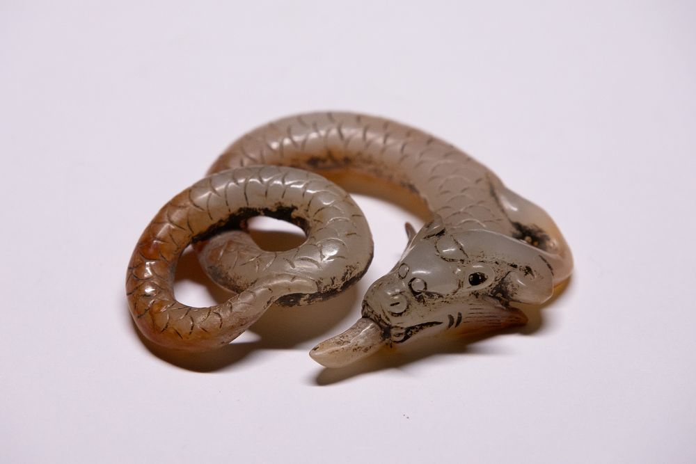 Lot 273: A Chinese Jade Carved Dragon Serpent Ornament.