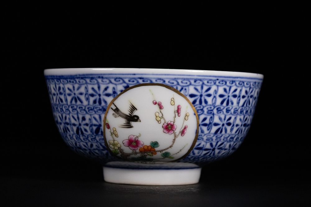 Lot 304: A Chinese Porcelain Bowl with Floral Cartouches.