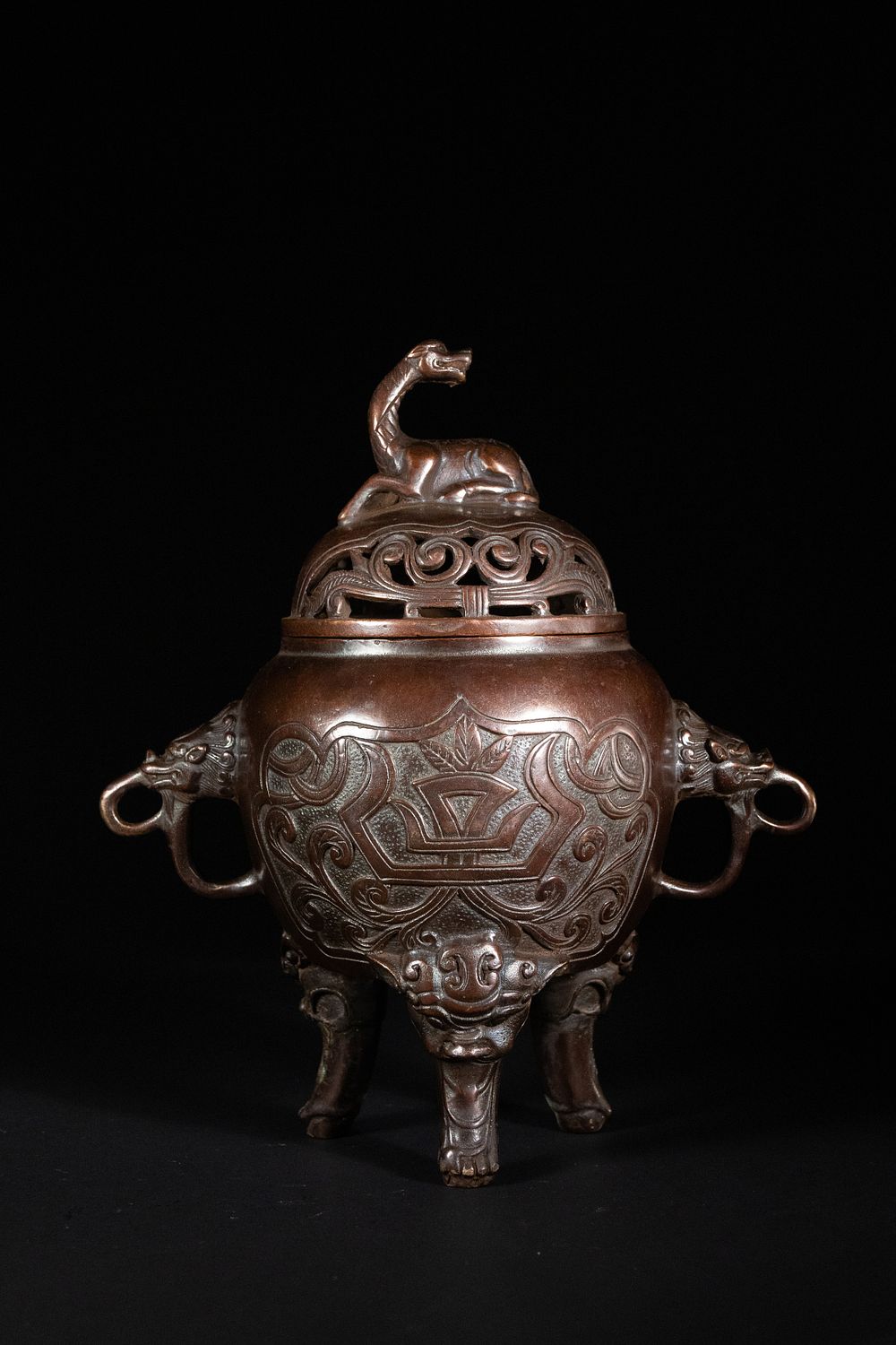 Lot 308: A Chinese Bronze Tripod Censer with Beast Finial...