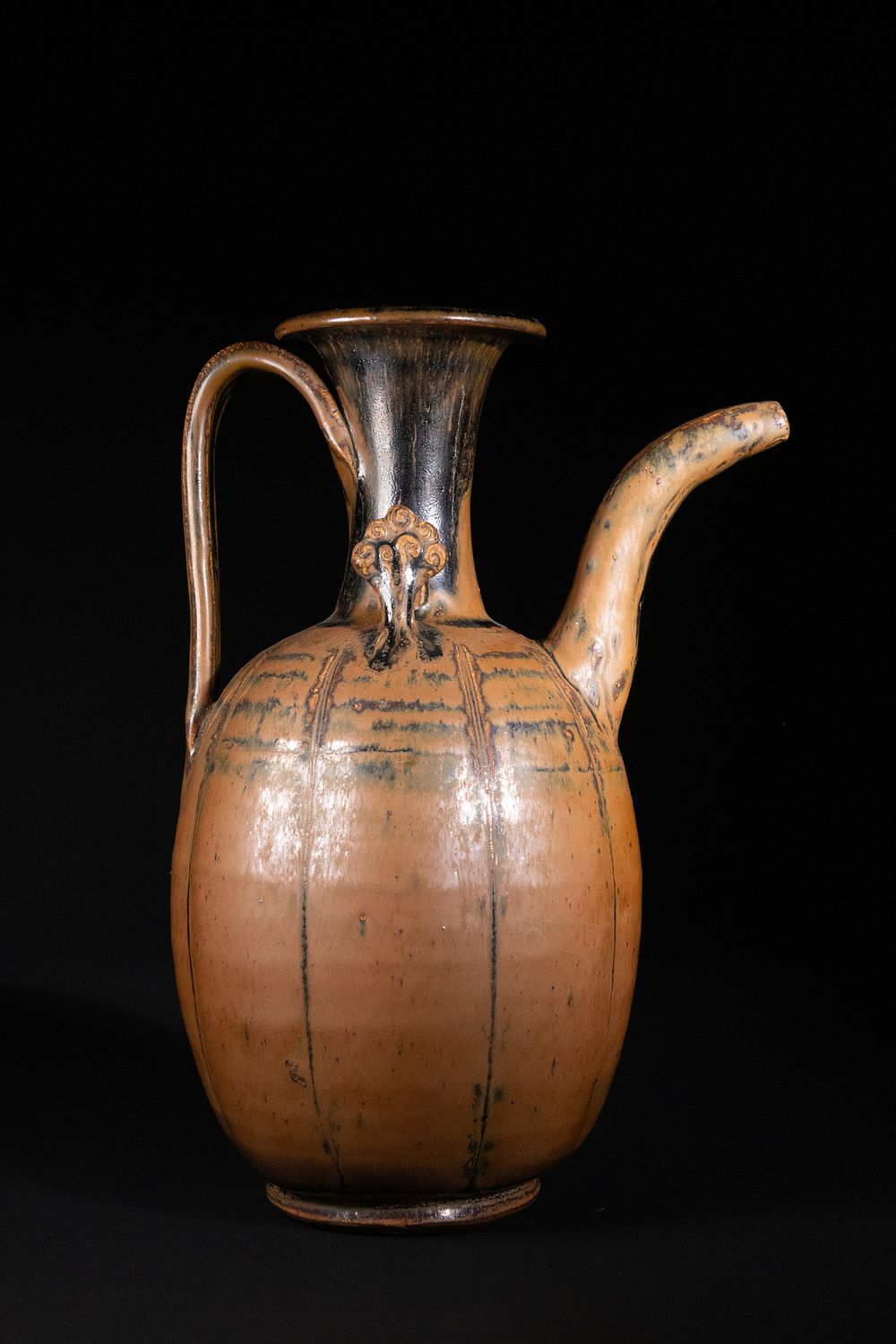 Lot 311: A Chinese Brown-Glazed Pottery Ewer with Arched Spout.