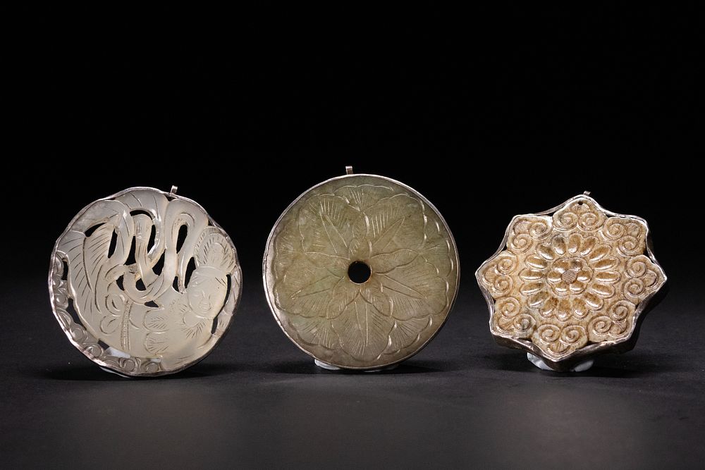 Lot 332: A Lot of Chinese Jade Pendants in Silver...