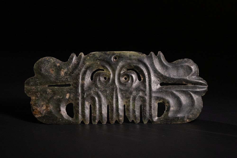 Lot 343: A Rare Chinese Jade Toothed Animal Mask Ornament.