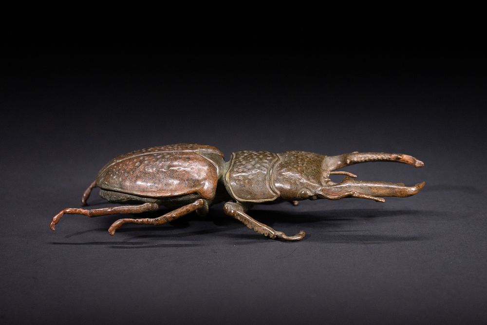 Lot 374: A Japanese Bronze Model of a Stag Beetle.