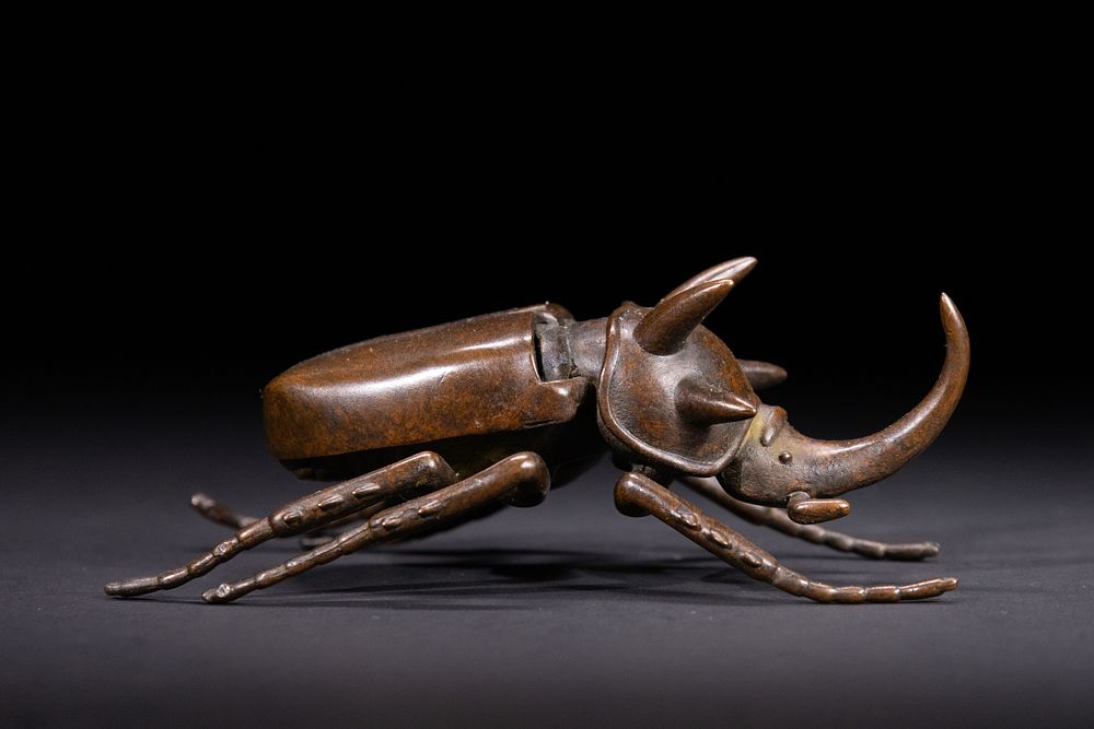 Lot 376: A Japanese Bronze Sculpture of a Rhinoceros Beetle.