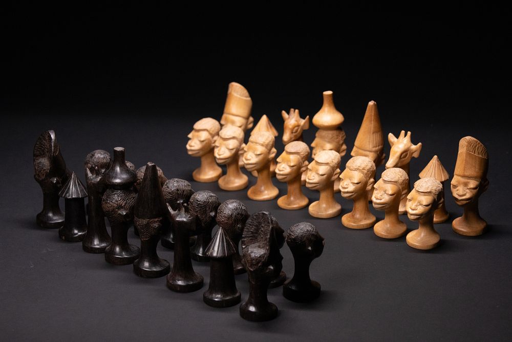 Lot 389: A Complete African Hand-Carved Figural Chess Set, 20th...