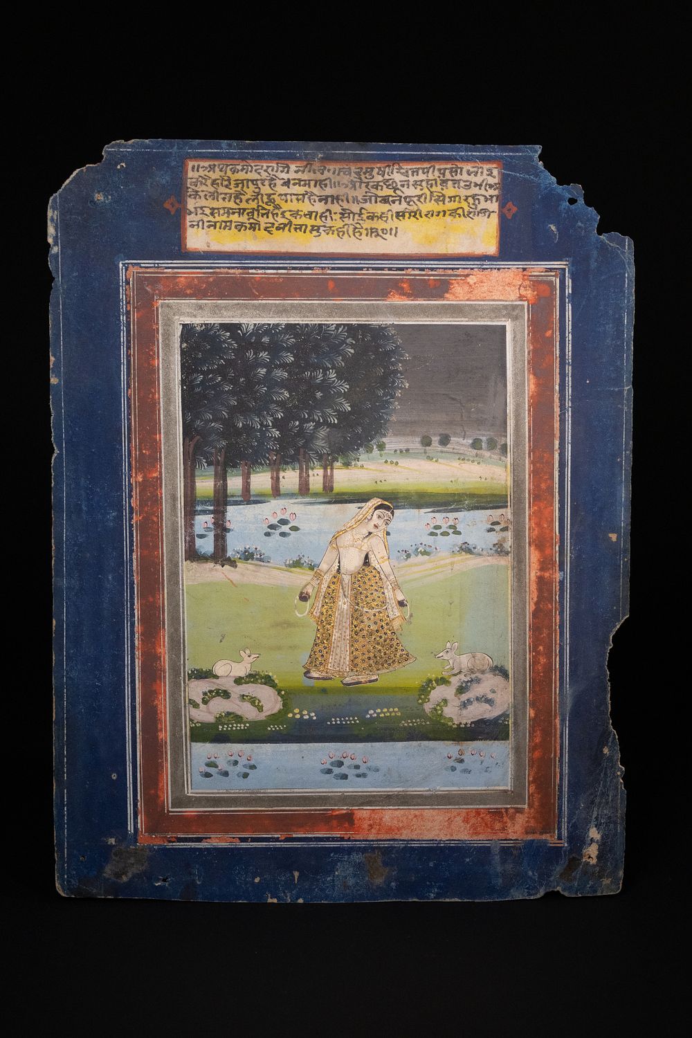 Lot 153: An Indian Miniature Painting of a Lady in...