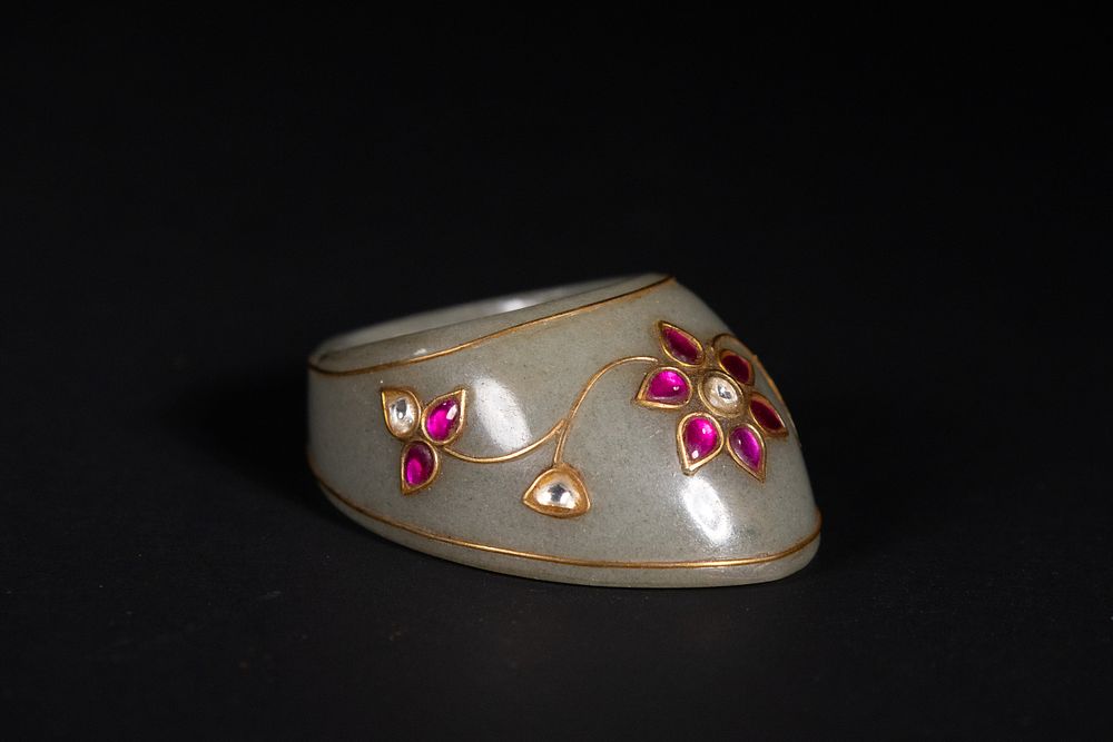 Lot 157: A Mughal Jade Archer’s Thumb Ring with Floral...