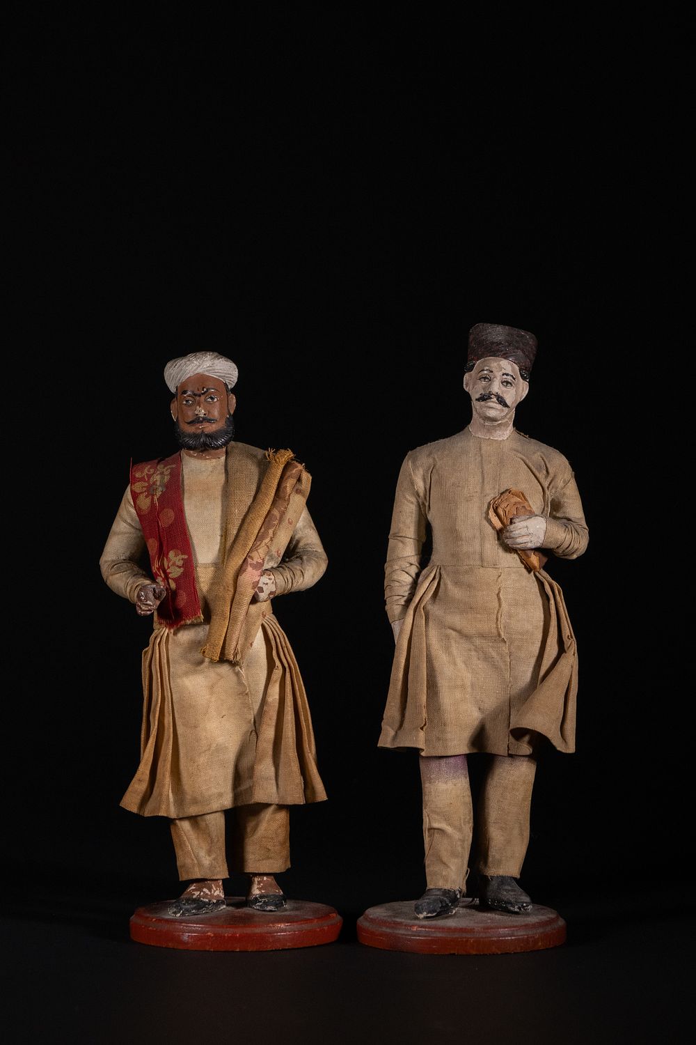 Lot 173: A Pair of Indian Male Merchant Figures in...