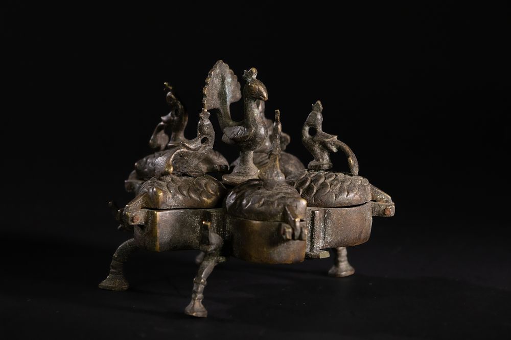 Lot 182: An Indian Rajasthani Brass Peacock Cosmetic Box.