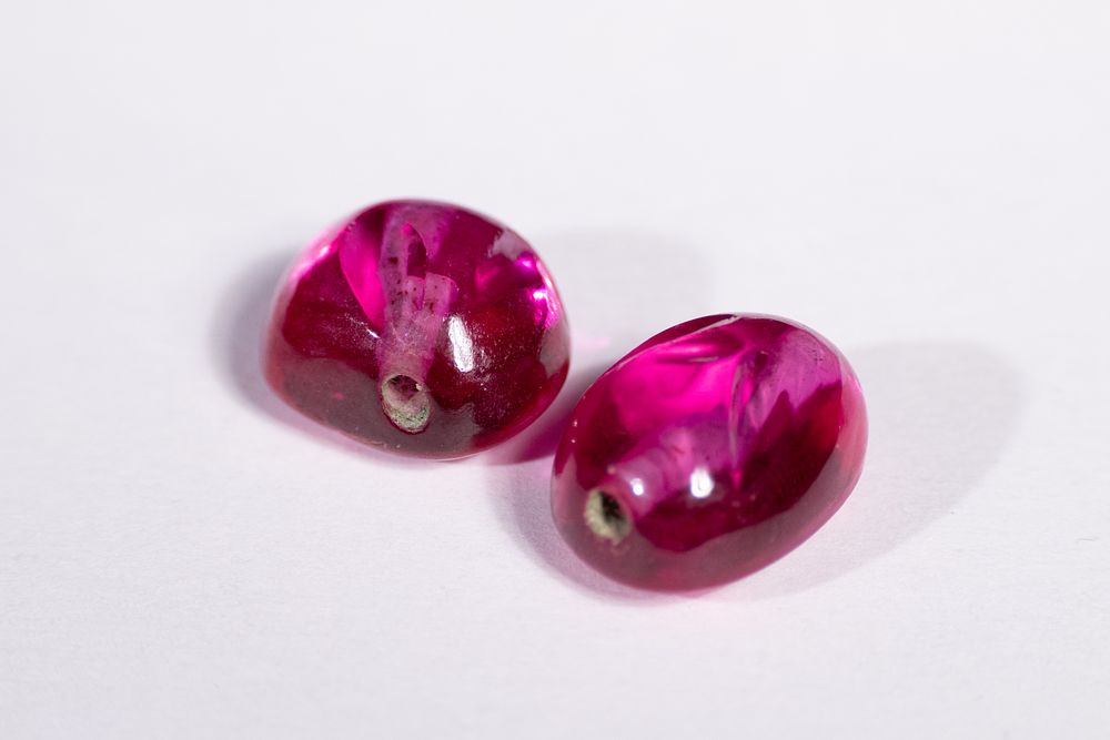 Lot 186: A Pair of Indian Deep Pink Beads, Possibly...