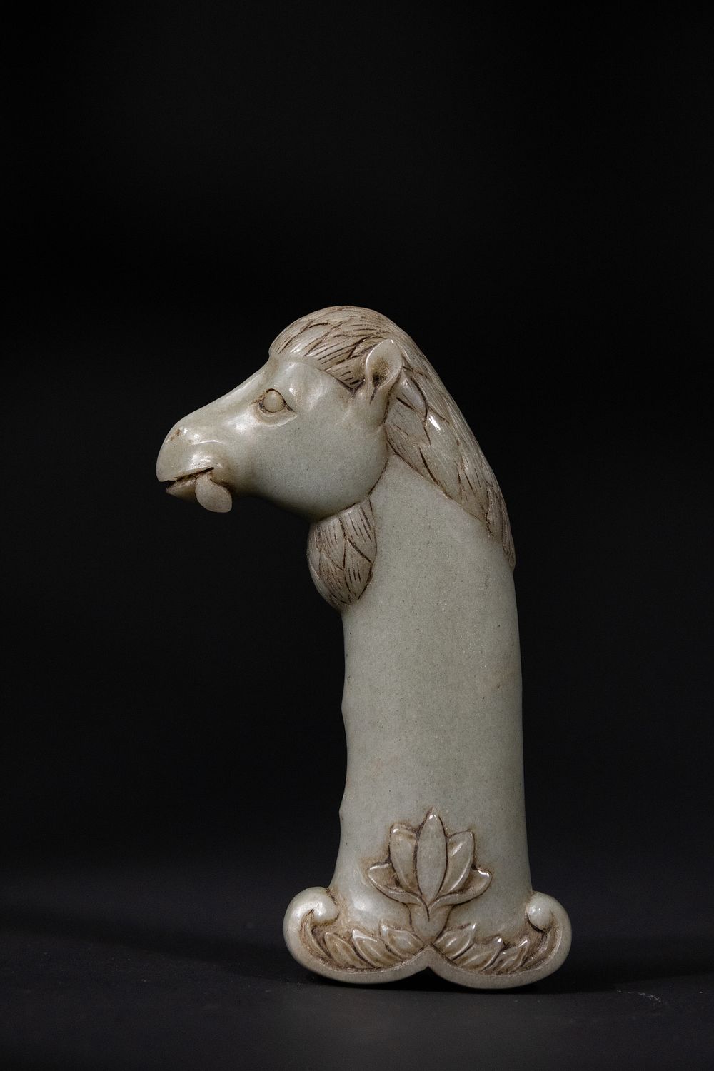Lot 187: A Mughal Carved Jade Horse-Head Hilt, 19th Century.