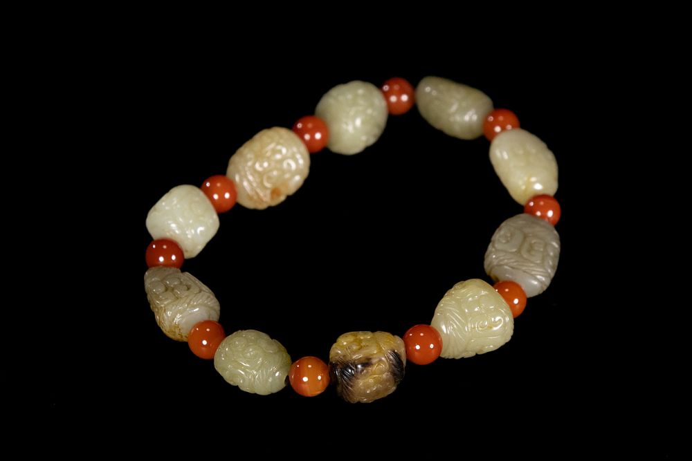 Lot 254: A Chinese Jade and Carnelian Bead Bracelet with...