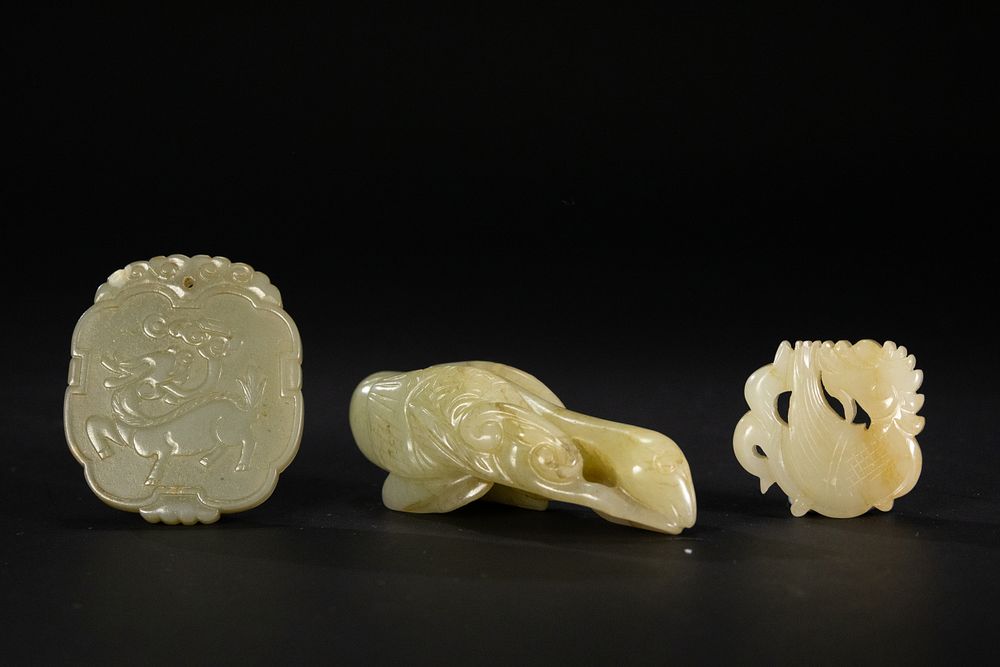 Lot 259: A Lot of Three Chinese Pale Celadon Jade...