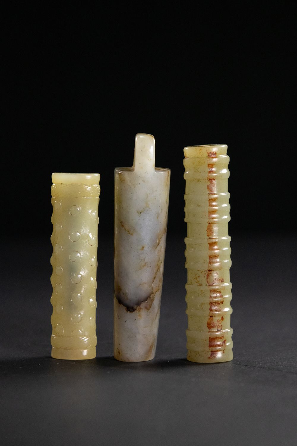 Lot 262: A Lot of Three Chinese Jade Tubular Ornaments.