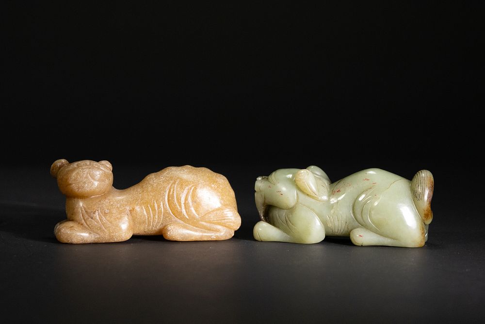 Lot 266: A Pair of Chinese Jade Carvings of Recumbent...