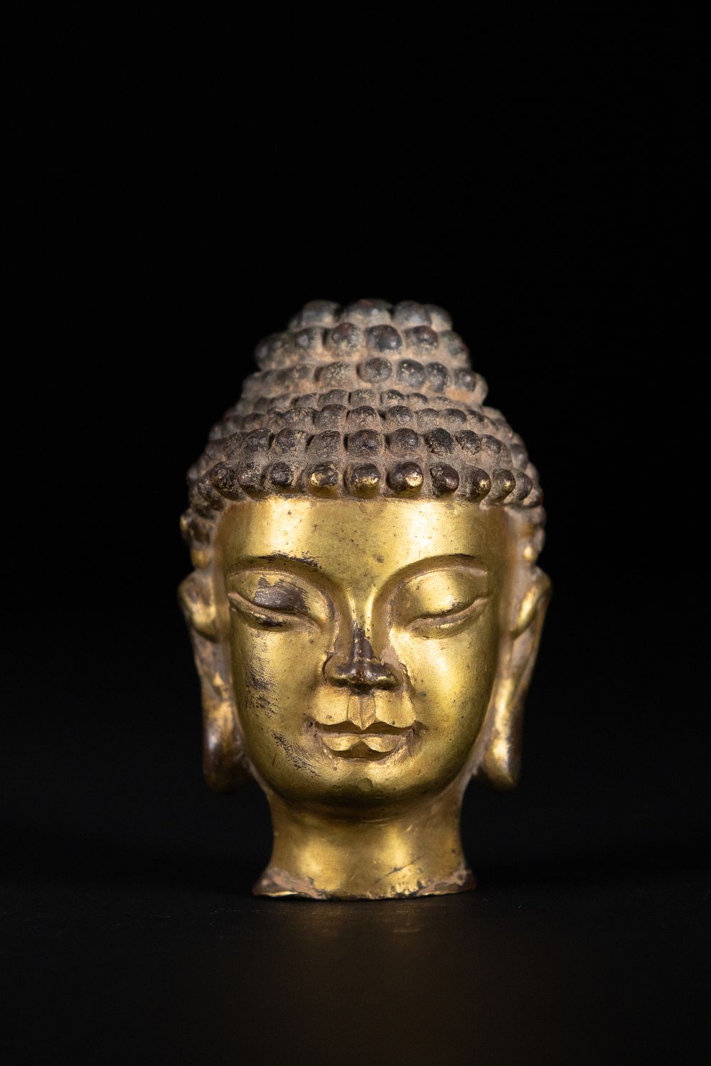 Lot 269: A Chinese Gilt-Bronze Head of Buddha Shakyamuni, 19th...