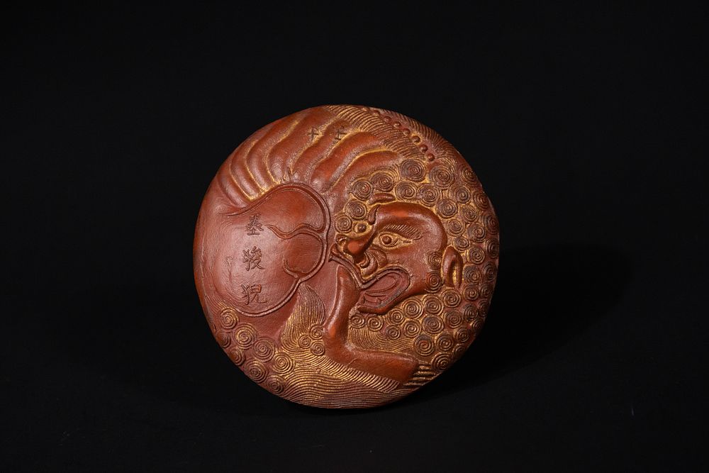Lot 277: A Pair of Chinese Red Clay Lion Medallions...